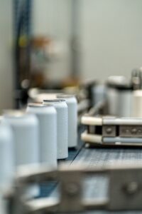 Aluminium aerosol cans on the filling line - OEM Malaysia