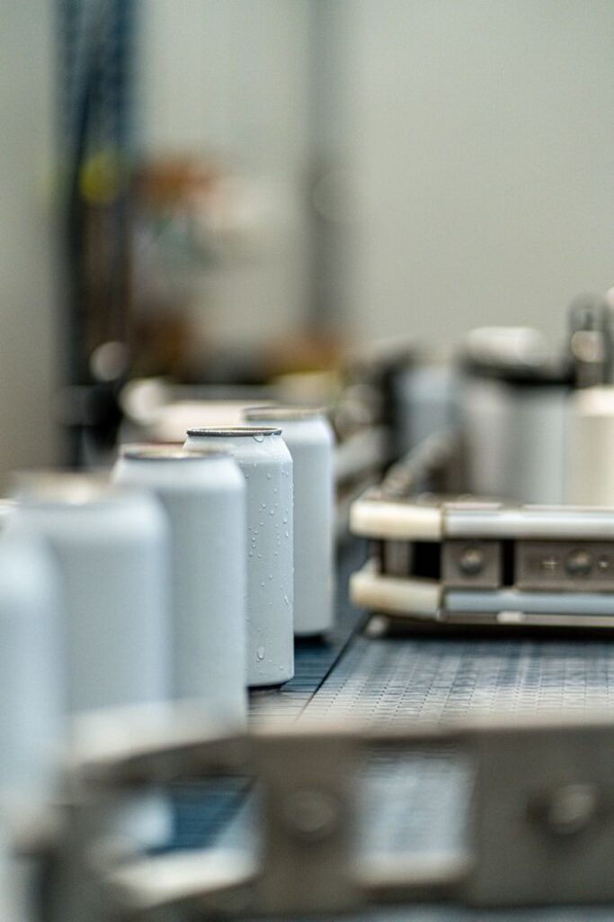 Aluminium aerosol cans on the filling line - OEM Malaysia