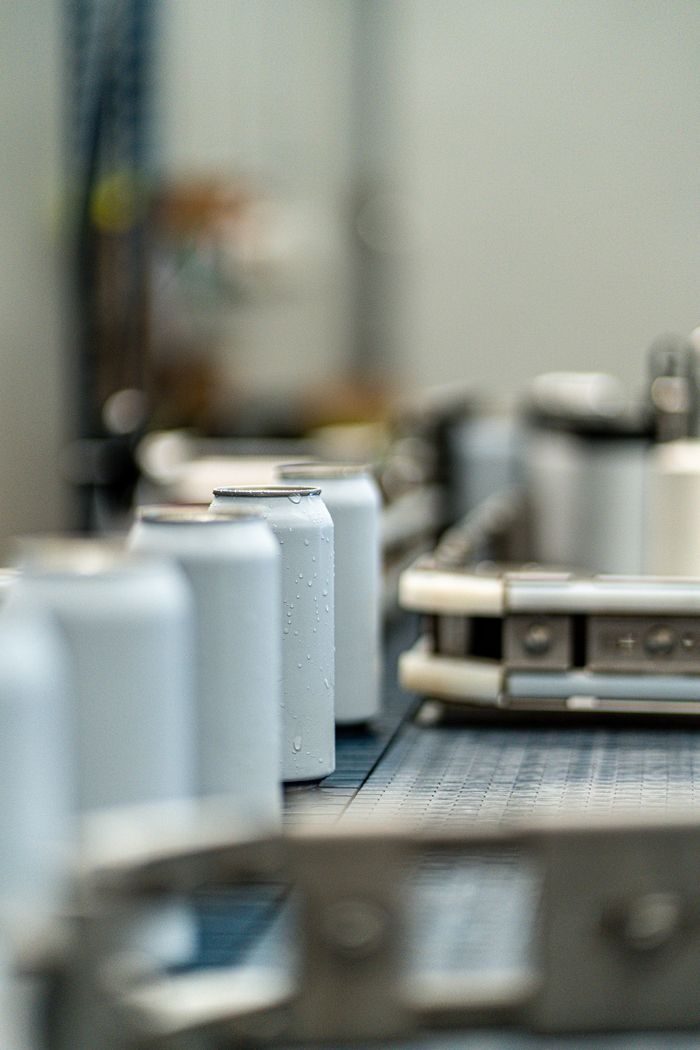 Aluminium aerosol cans on the filling line - OEM Malaysia