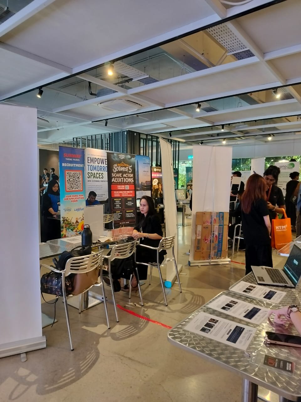 Exhibition booths and recruitment counters at QIU Industry Day 2026