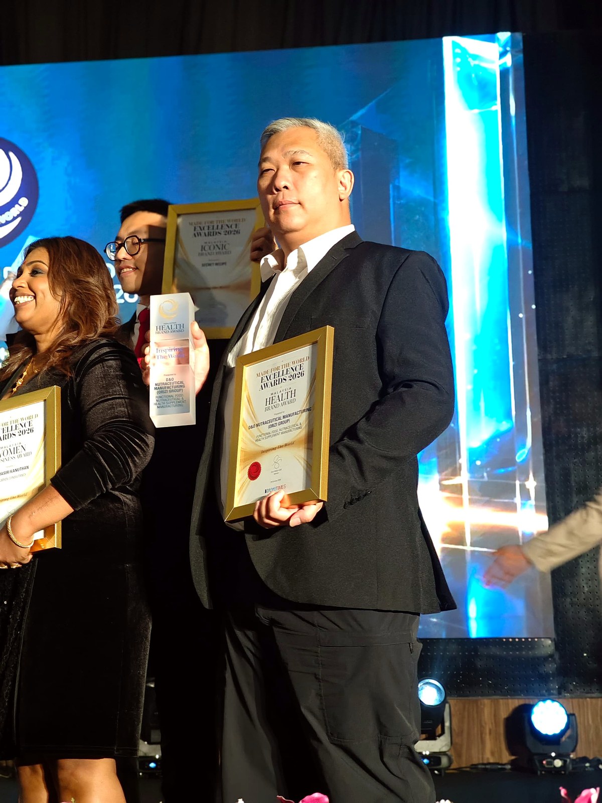 Kok Toong Hoi, Manufacturing Director, on stage with the Malaysia Health Brand Award, Made for the World Excellence Awards 2026
