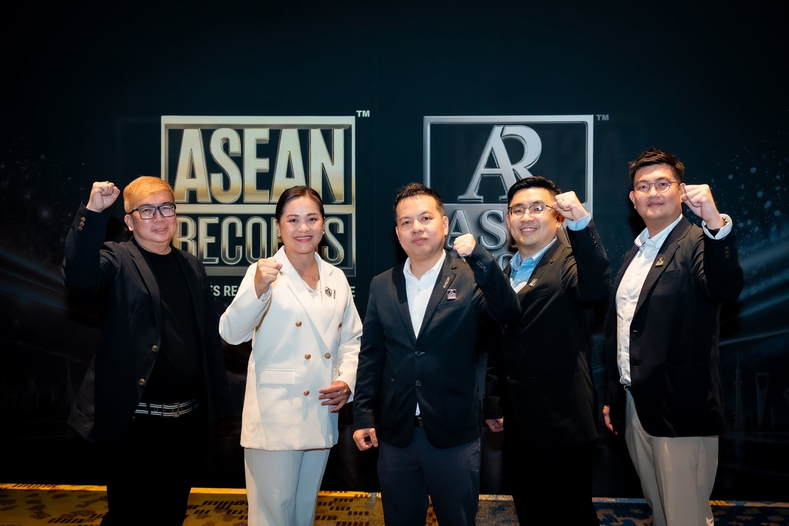 The ORIZI Group team in front of the ASEAN Records and ASIA Records marks, 20 October 2026.
